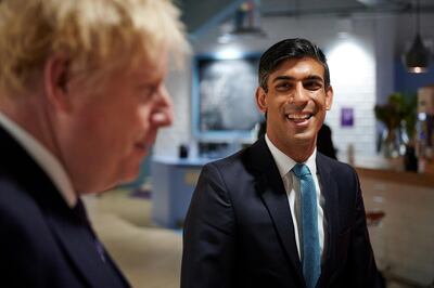 Britain's Prime Minister Boris Johnson and Britain's Chancellor of the Exchequer Rishi Sunak visit the headquarters of Octopus Energy, in London, Britain October 5, 2020. Leon Neal/Pool via REUTERS