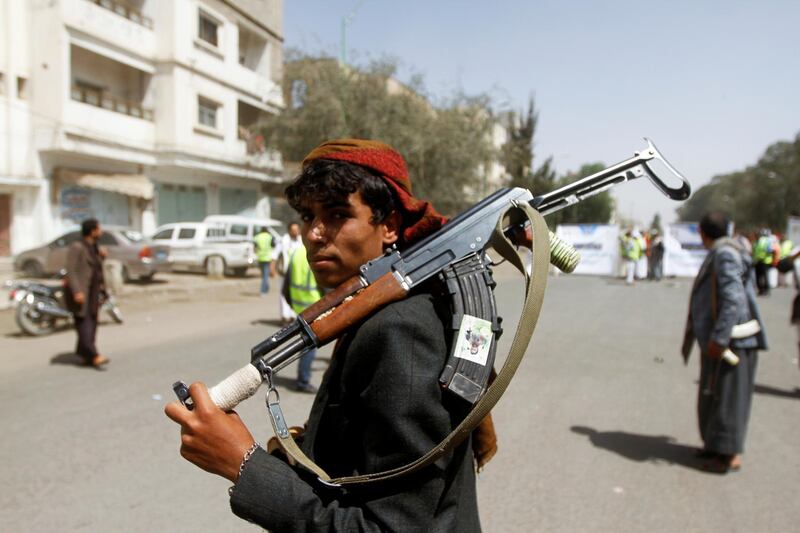 A Houthi supporter looks on as he carries a weapon during a gathering in Sanaa, Yemen April 2, 2020. REUTERS/Mohamed al-Sayaghi
