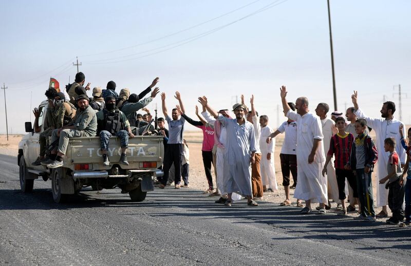 epa06269391 Kirkuk residents from the Arab population greet the members of Iraqi Shiite group which also known as Hashd al-Shaabi (The Popular Crowd) as they advance into central Kirkuk city, northern Iraq, 16 October 2017. Media reports state that the Iraqi military troops took over large areas from Kurdish Peshmerga militants without fighting, while an Iraqi military source announced that the Iraqi forces took several positions south of Kirkuk from Kurdish forces, including the North Gas Company station, a nearby processing plant and the industrial district south of the city. Thousends of Kurds families left the city due the fighting between Shiite militias and groups of Kurdish gunmen in southern the city, a local official said.  EPA/MURTAJA LATEEF