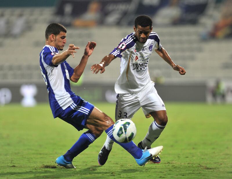 Al Nasr (Blue) matches up against Al Ain (White) at Al Maktoum Stadium on Tuesday November 13, 2012. (Al Ittihad)