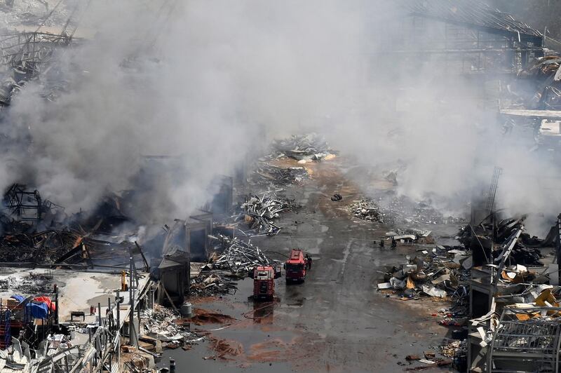 Firefighters extinguish a fire in warehouses at the port of Beirut. EPA