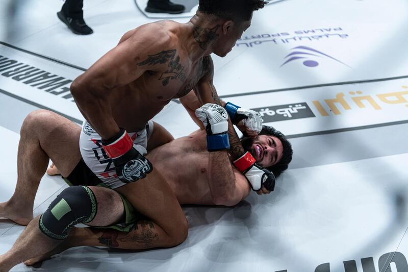 Brazilian Vinicius de Oliveira has the Russian Furkatbek Yokubov down on the canvas. Courtesy Palms Sports