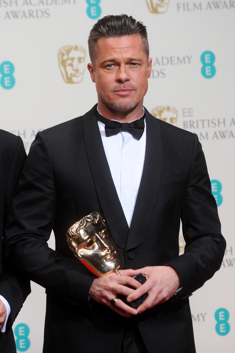 LONDON, ENGLAND - FEBRUARY 16:  Producer and actor Brad Pitt, winner of the Best Film award, poses in the winners room at the EE British Academy Film Awards 2014 at The Royal Opera House on February 16, 2014 in London, England.  (Photo by Anthony Harvey/Getty Images)