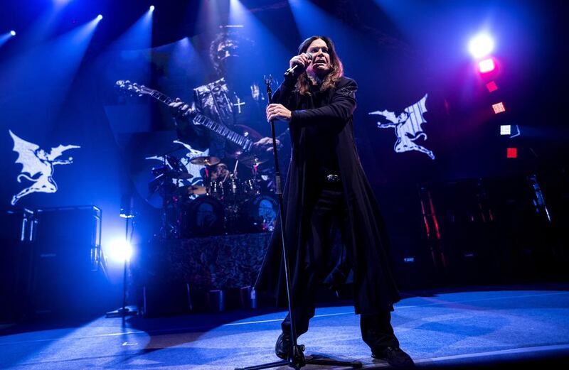 Ozzy Osbourne of Black Sabbath performs with guitarist Tony Iommi, seen on screen behind, during a concert in Denmark last year. AP photo