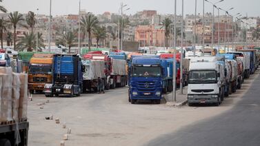 Trucks laden with humanitarian aid wait at the Rafah border crossing between Egypt and the Gaza Strip. Reuters