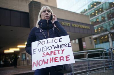 A campaigner at the sentencing of Metropolitan police officer David Carrick. PA