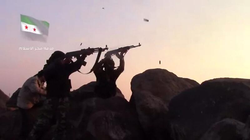 Free Syrian Army fighters battle militants from the ISIL affiliated Khaled Bin Waleed Army, during a lightening offensive by the extremists in southern Syria in February. Free Syrian Army / YouTube