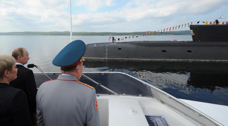 epa07689596 Russian President Vladimir Putin (2-L) on board a motorboat to review the Northern Fleet ships on Navy Day in Severomorsk, Murmansk Region, Russia, 27 July 2014 (reissued 02 July 2019). According to media reports citing the Russian Ministry of Defense, a fire incident inside a Russian submarine has left 14 people dead. The vessel is apparently part of the Northern Fleet, which is based in Severomorsk.  EPA/MIKHAIL KLIMENTYEV / RIA NOVOSTI / KREMLIN POOL MANDATORY CREDIT