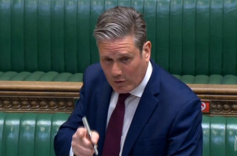 A video grab from footage broadcast by the UK Parliament's Parliamentary Recording Unit (PRU) shows Britain's main opposition Labour Party leader Keir Starmer taking part in the weekly Prime Minister's Questions (PMQs) at the House of Commons in London on April 28, 2021. Britain's Electoral Commission on Wednesday announced a formal investigation into how Prime Minister Boris Johnson paid for a lavish makeover of his Downing Street flat, seriously escalating a simmering scandal. - RESTRICTED TO EDITORIAL USE - MANDATORY CREDIT " AFP PHOTO / PRU " - NO USE FOR ENTERTAINMENT, SATIRICAL, MARKETING OR ADVERTISING CAMPAIGNS
 / AFP / PRU / - / RESTRICTED TO EDITORIAL USE - MANDATORY CREDIT " AFP PHOTO / PRU " - NO USE FOR ENTERTAINMENT, SATIRICAL, MARKETING OR ADVERTISING CAMPAIGNS
