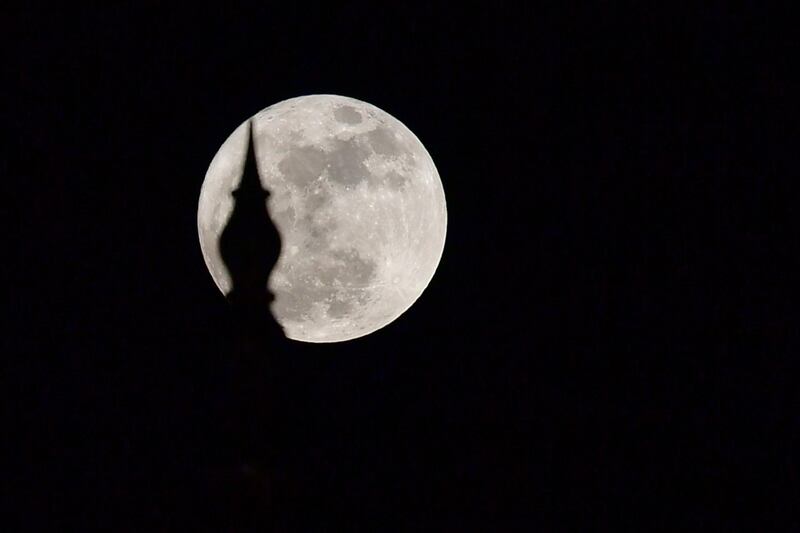 The "supermoon" rises over the Sheikh Zayed Grand Mosque in Abu Dhabi. Guiseppe Cacace / AFP