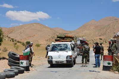 epa06906590 A handout photo made available by the Syrian Arab News Agency (SANA) shows hundreds of Syrian refugees returning from the Lebanese territories through al-Zamrani corridor to their homes in al-Qalamoun area in Damascus countryside, Syria, 23 July 2018. According to media reports, Lebanon hosts 1,011,366 Syrian refugees registered with UNHCR, Including 80 thousand refugees living in seven camps in the city of Arsal. Some 900 displaced Syrians would return. this is the third batch of displaced Syrians, who have recently returned to their homeland.  EPA/SANA HANDOUT  HANDOUT EDITORIAL USE ONLY/NO SALES