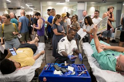 Israelis donate blood in Tel Aviv's Sourasky Medical Centre after an official plea for donations, on Saturday. Getty Images