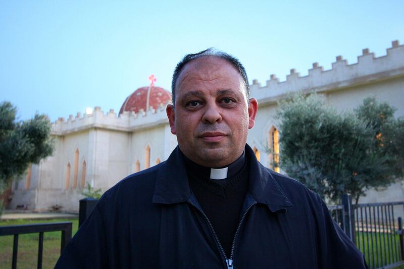 IRAQ-MOSUL_S TWO GOVERNORS-PICTURED-Father Thaabit standing outside Mar Giwargis Monastery in Assyrian town Karemlash which was liberated from ISIS in October 2016. Charlie Faulkner for The National