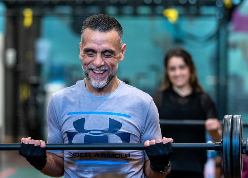 Ihsan Al Sakka does weight training and cardio excercises with his children, Huda, 15 and Nur, 20 at the Abu Dhabi Country Club on June 1st, 2021. Victor Besa / The National.
Reporter: Haneen Dajani for News