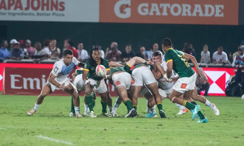 A South Africa player passes the ball to a teammate.