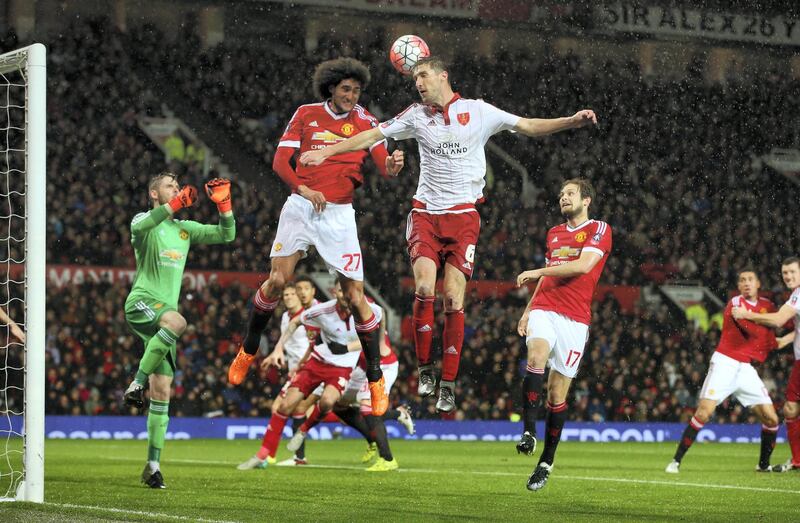 MANCHESTER, ENGLAND - JANUARY 09: Chris Basham of Sheffield United wins a header from Marouane Fellaini of Manchester United during the Emirates FA Cup Third Round match between Manchester United and Sheffield United at Old Trafford on January 9, 2016 in Manchester, England.  (Photo by Alex Livesey/Getty Images)