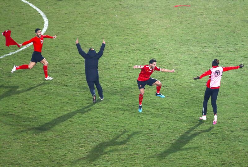 Ahly's players celebrate winning the CAF Champions League Final football match between Egyptian sides Zamalek and Al-Ahly at the Cairo International Stadium in Egypt's capital on November 27, 2020. (Photo by Khaled DESOUKI / AFP)