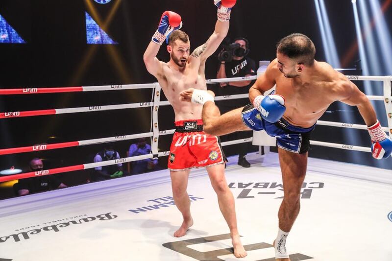 Ilyas Habibali, right, lands a kick on Damian Darker. Courtesy UAE Muaythai and Kickboxing Federation