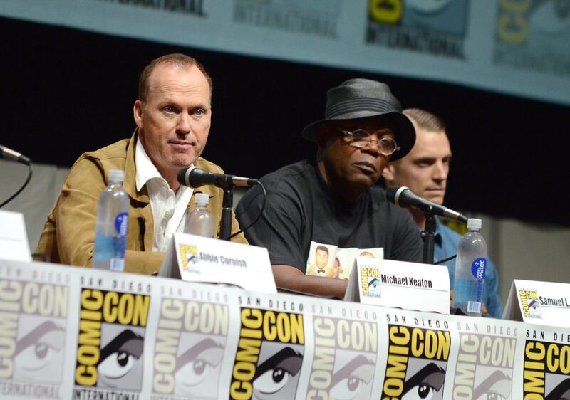 Michael Keaton, left, Samuel L. Jackson, center, and Joel Kinnaman attend the "RoboCop" panel on Day 3 of Comic-Con International on Friday, July 19, 2103 in San Diego.. (Photo by Jordan Strauss/Invision/AP) *** Local Caption ***  2013 Comic-Con - RoboCop Panel.JPEG-0c97c.jpg