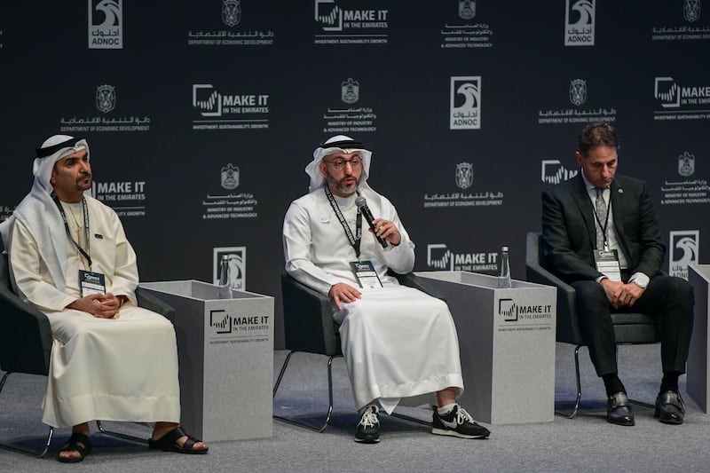 Saud Al Shawareb, executive vice president of industrial leasing at Dubai Industrial City, centre, says products manufactured at Dubai Industrial City are being exported to more than 80 countries. Khushnum Bhandari / The National