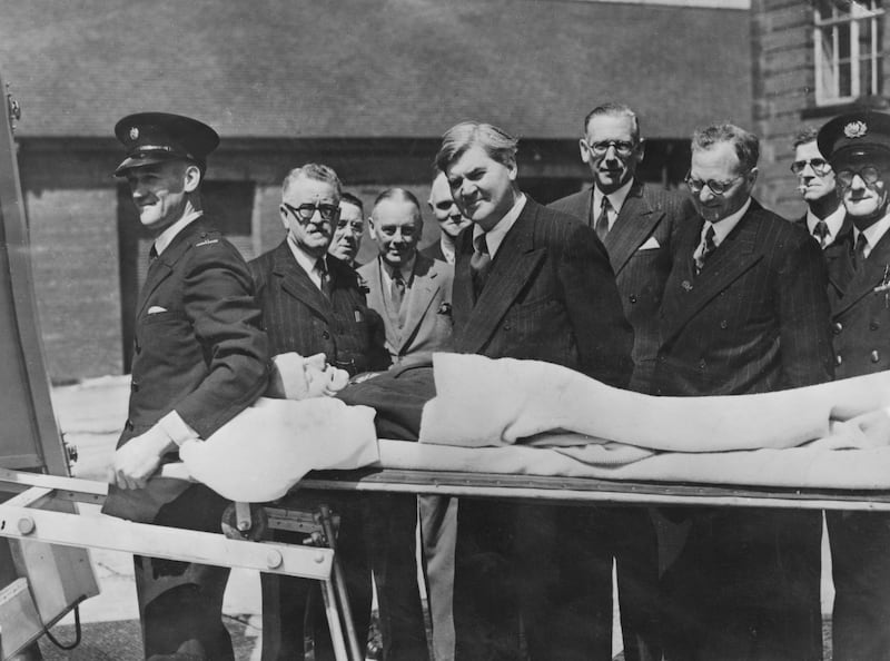 Minister for health Aneurin Bevan watches a demonstration of a new stretcher in Preston, on the first day of the new National Health Service. Getty Images