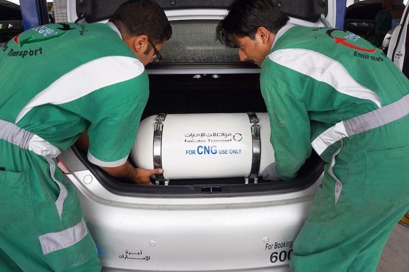 A CNG tank is installed in a vehicle at a conversion station in Khalifa City.  DELORES JOHNSON / The National