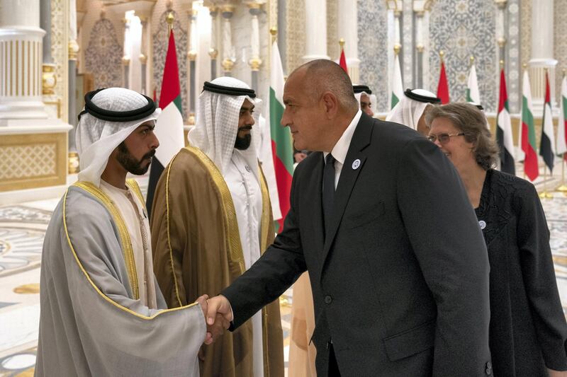 ABU DHABI, UNITED ARAB EMIRATES - October 21, 2018: HH Sheikh Khalifa bin Tahnoon bin Mohamed Al Nahyan, Director of the Martyrs' Families' Affairs Office of the Abu Dhabi Crown Prince Court (L) greets HE Boyko Borissov, Prime Minister of Bulgaria (3rd L), during a reception at the Presidential Palace. Seen with HH Sheikh Diab bin Tahnoon bin Mohamed Al Nahyan (2nd L).

( Hamad Al Kaabi / Crown Prince Court - Abu Dhabi )
---