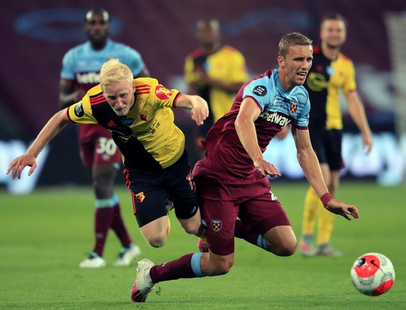 West Ham United's Tomas Soucek in action with Watford's Will Hughes. EPA