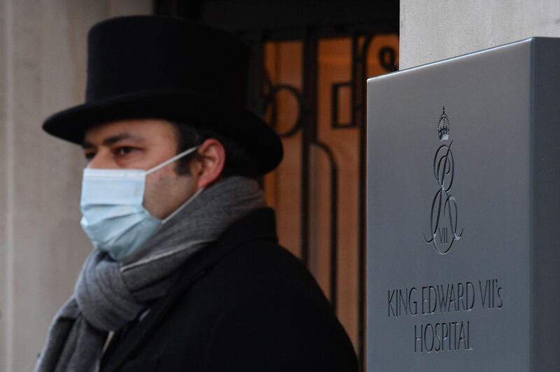 A doorman stands at the entrance to the hospital. AFP
