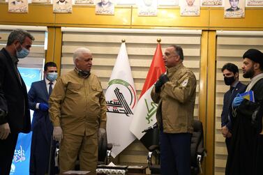 Iraqi Prime Minister Mustafa al-Kadhimi wears a military uniform of Popular Mobilisation Forces. Iraqi Prime Minister Media Office/Reuters