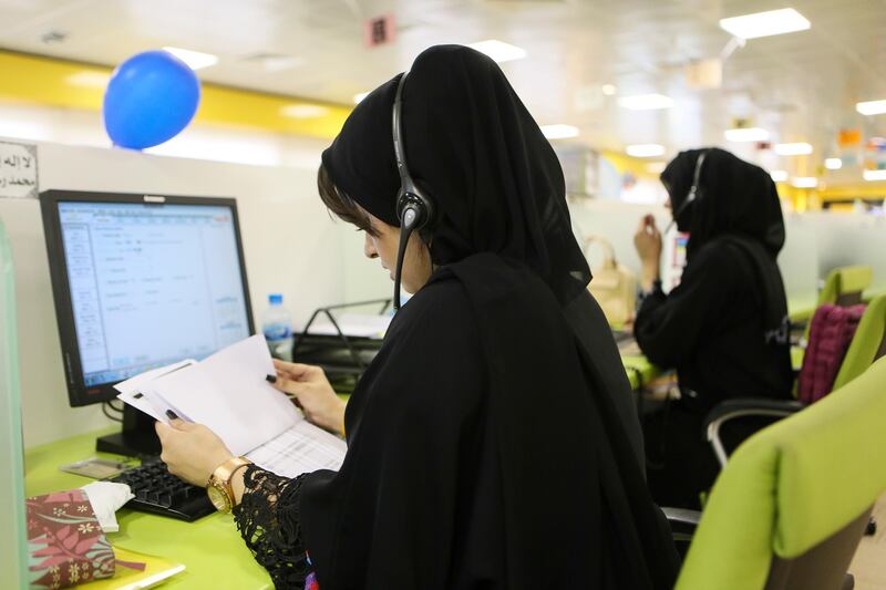 AL AIN , UNITED ARAB EMIRATES. June 14 , 2015  -  Emirati women work at the Etihad Contact Centre in Al Ain, June 14, 2015. (Photo by: Sarah Dea/The National, Story by: Suzanne Locke, Business)
 *** Local Caption ***  SDEA140615-etihad19.JPG
