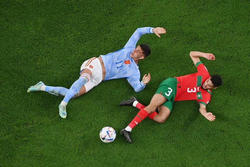 Ferran Torres and Noussair Mazraoui go to ground. Getty