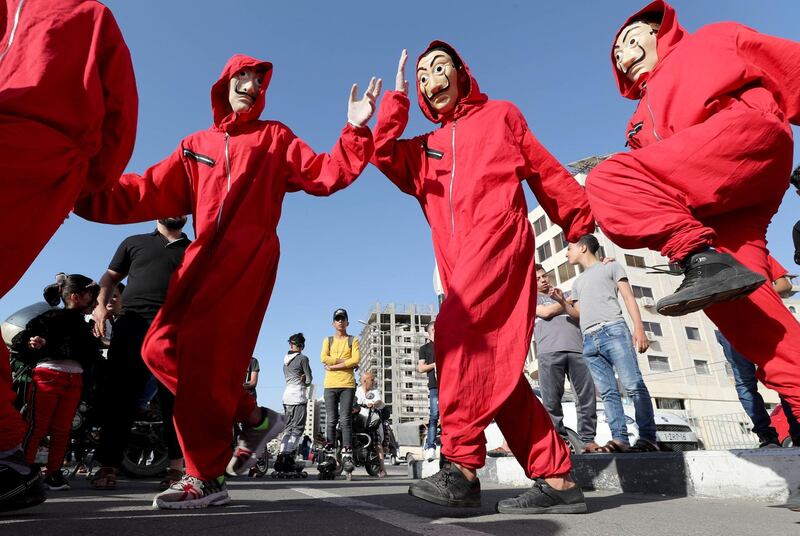 Members of a Palestinian team called ''Bella Ciao", dressed as actors of "La Casa de Papel (Money Heist)" series, perform in Gaza City. Reuters