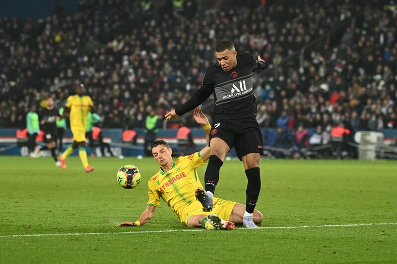 Paris Saint-Germain's French forward Kylian Mbappe fights for the ball. AFP