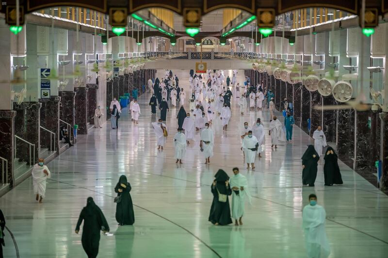 Muslims, keeping a safe social distance, perform Umrah at the Grand Mosque after Saudi authorities eased the coronavirus disease (COVID-19) restrictions. Reuters