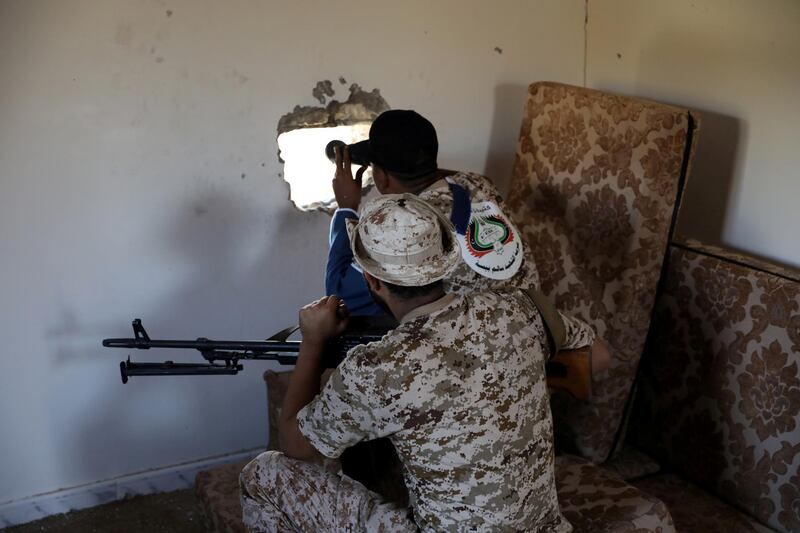 FILE PHOTO: Members of the Libyan internationally recognised government forces take their positions in Ain Zara, Tripoli, Libya October 14, 2019. Picture taken October 14, 2019. REUTERS/Ismail Zitouny/File Photo