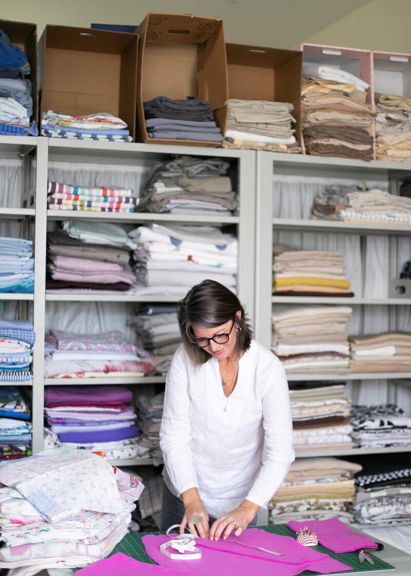 DUBAI, UNITED ARAB EMIRATES. 3 DECEMBER 2019. 
Ceri Rocca, who helps run Rags to Riches UAE. 

Founded five years ago, the community group sews, knits and quilts unused fabrics into clothes such as shirts, shorts, hoodies, tracksuit bottoms and dresses, and are then donated to children living in orphanages and refugee camps.

(Photo: Reem Mohammed/The National)

Reporter:
Section: