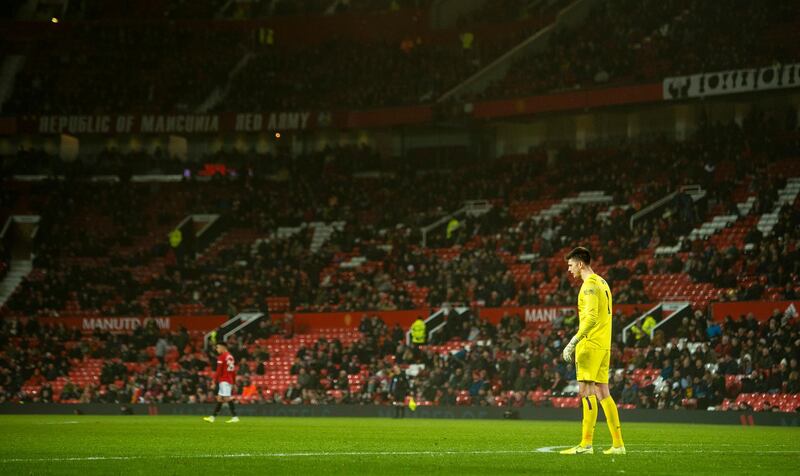 Burnley goalkeeper Nick Pope in front of empty seats at Old Trafford. EPA