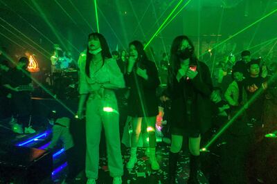 In this picture taken on January 21, 2021, people visit a nightclub in Wuhan, China's central Hubei province. / AFP / Hector RETAMAL
