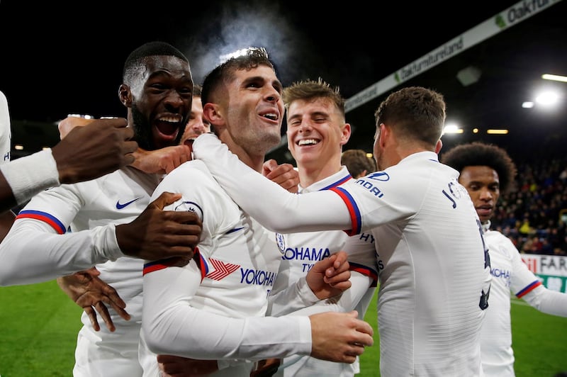 Soccer Football - Premier League - Burnley v Chelsea - Turf Moor, Burnley, Britain - October 26, 2019  Chelsea's Christian Pulisic celebrates scoring their third goal to complete his hat-trick with team mates   Action Images via Reuters/Lee Smith  EDITORIAL USE ONLY. No use with unauthorized audio, video, data, fixture lists, club/league logos or "live" services. Online in-match use limited to 75 images, no video emulation. No use in betting, games or single club/league/player publications.  Please contact your account representative for further details.     TPX IMAGES OF THE DAY