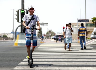 Abu Dhabi, United Arab Emirates, August 13, 2019.  People using E-scooters at the Al Wahda mall area, downtown Abu Dhabi. --  Perry Malapitan, takes an E-scooter everyday to work at downtown Abu Dhabi.
Victor Besa/The National
Section:  NA
FOR:  Standalone
