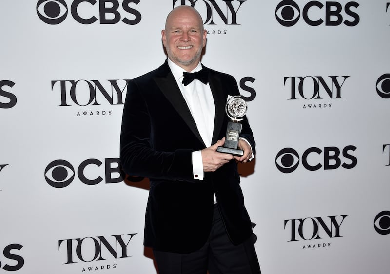 Chris Harper with his award for Best Revival of a Musical for 'Company'. AP