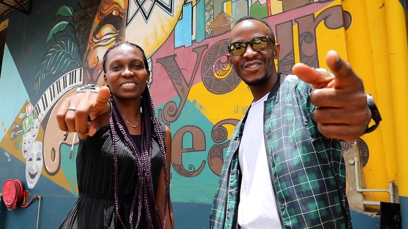 Artist Mercy Vini with MF Semuju at Vodo Art Society. They have painted several murals at the gallery at MoTiV, an incubator supporting young entrepreneurs in Uganda. Photo: Andy Scott