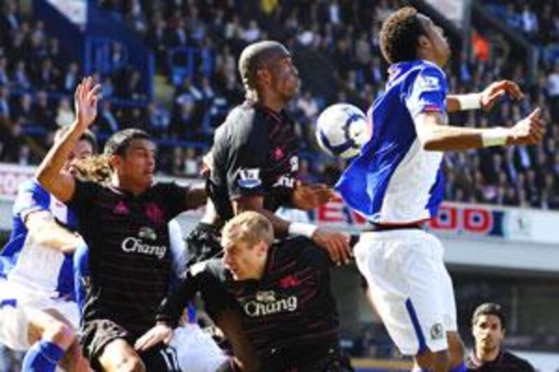 Everton players fight for the ball yesterday.