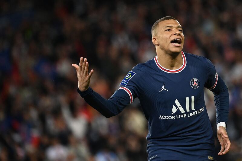 Paris Saint-Germain's French forward Kylian Mbappe celebrates scoring his team's second goal during the French L1 football match between Paris-Saint Germain (PSG) and Olympique Marseille (OM) at The Parc des Princes Stadium in Paris on April 17, 2022.  (Photo by FRANCK FIFE  /  AFP)