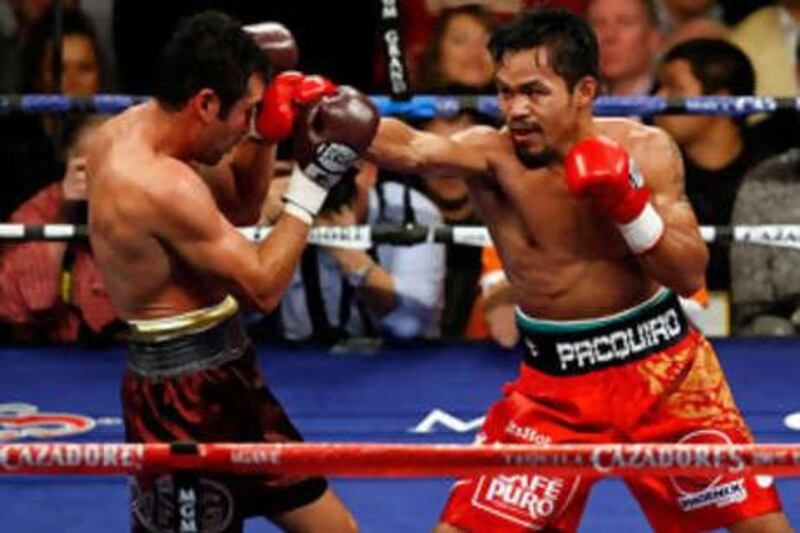 Manny Pacquiao of the Philippines connects with a right to the head of Oscar De La Hoya during their welterweight fight in Las Vegas.