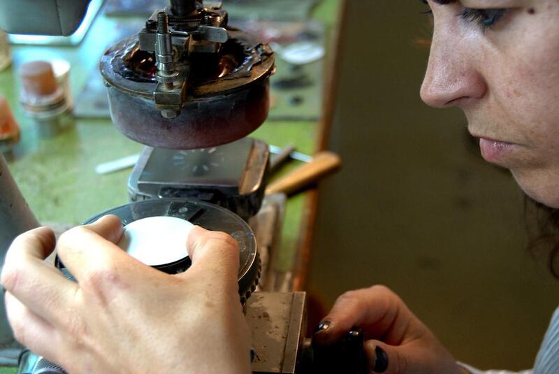 A watchmaker works on the dial of a timepiece. Courtesy Atelier Laurent Ferrier