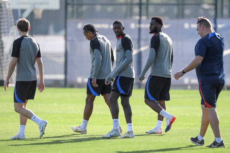 Barcelona's Ousmane Dembele with teammates during training. AFP