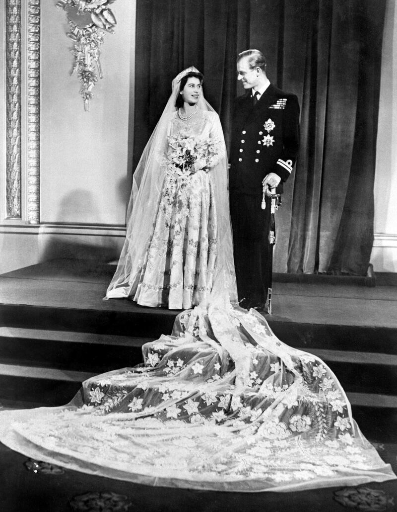 Britain's Princess Elizabeth (future Queen Elizabeth II) (L) and Philip, Duke of Edinburgh (R) pose on their wedding day at Buckingham Palace in London on November 20, 1947. (Photo by - / - / AFP)