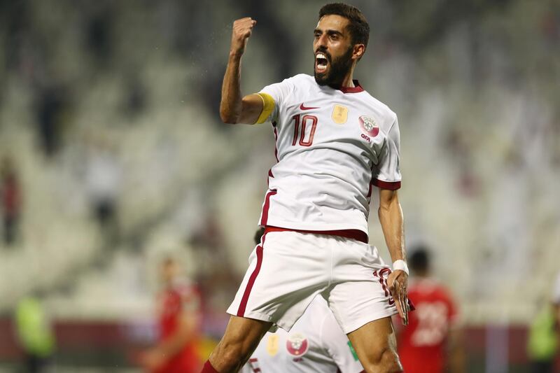 Qatar's Hassan Al Haydos celebrates scoring the goal.